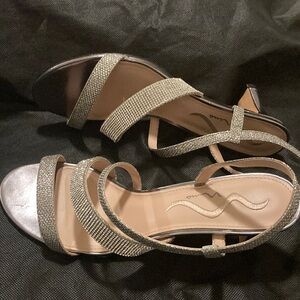 Elegant classy, silver women’s shoe embellished with rhinestones.